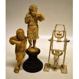 A pair of German eighteenth century carved ivory figures of young gardeners, one smelling a rose, on
