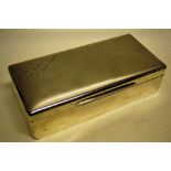 A large rectangular silver cigarette box, cedar lined and gilded inside, the hinged lid with later
