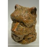 A nineteenth century Staffordshire saltglaze tobacco jar, moulded as a terriers head with detachable