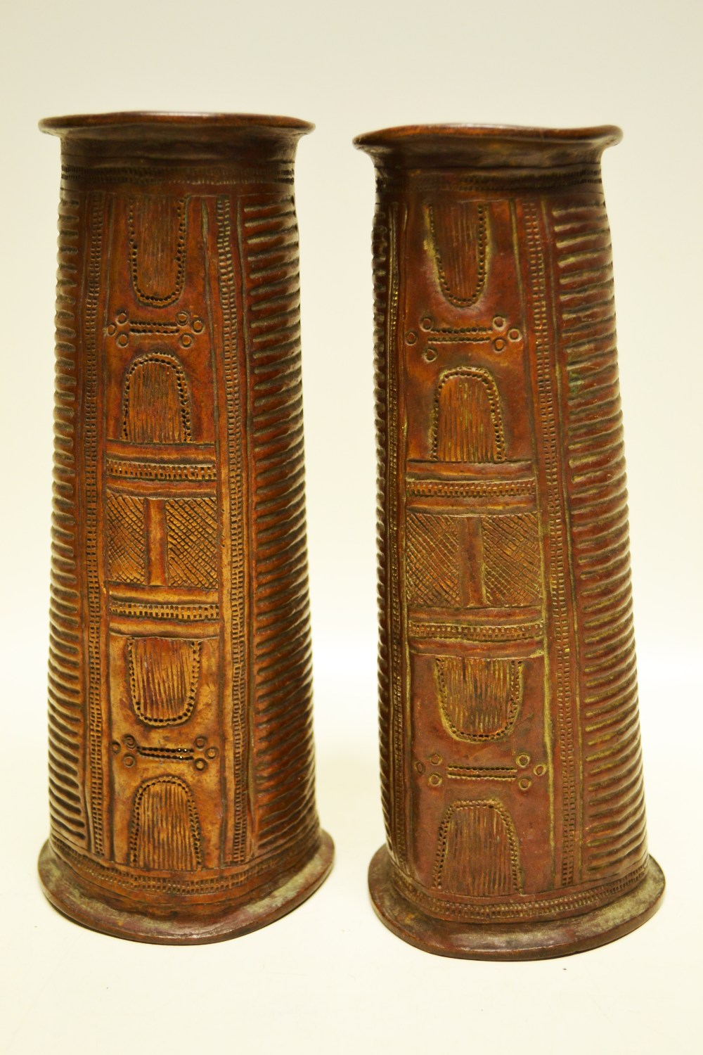 A pair Yoruba African copper leg ornaments, Nigerian. (Probably nineteenth century). 9.5in (24cm).