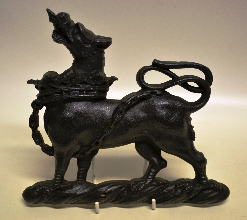 A Victorian cast iron heraldic hound ambient, with chained coronet collar. 8.5in