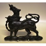 A Victorian cast iron heraldic hound ambient, with chained coronet collar. 8.5in