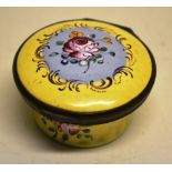 A Bilston yellow enamel circular patch box, the hinged lid with a rose, a mirror inside, fluted