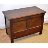 A Commonweath small oak blanket chest with a frieze drawer, the moulded edge hinged lid top with