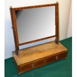An early nineteenth century mahogany rectangular swing toilet mirror, inlaid stringing, the