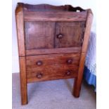 A Sheraton mahogany bedside tray top night commode, the cupboard enclosed by a pair of doors, inlaid