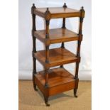 An early Victorian mahogany whatnot, the three tiers on turned and block corner supports with turned