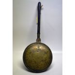 A William and Mary brass warming pan, the pierced hinged cover engraved a pheasant and a tulip,