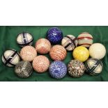 A set of fifteen glazed white and coloured patterned Victorian carpet bowls. (Slight chipping)