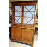 A late nineteenth century mahogany library bookcase, the key moulded cavetto cornice above