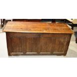 An oak Dower chest, the hinged moulded edge lid to a seventeenth century panelled carcase. 4ft
