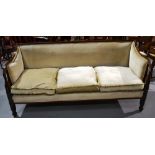 A Regency mahogany show frame three seater settee, the upholstered back with a reeded edge, the seat