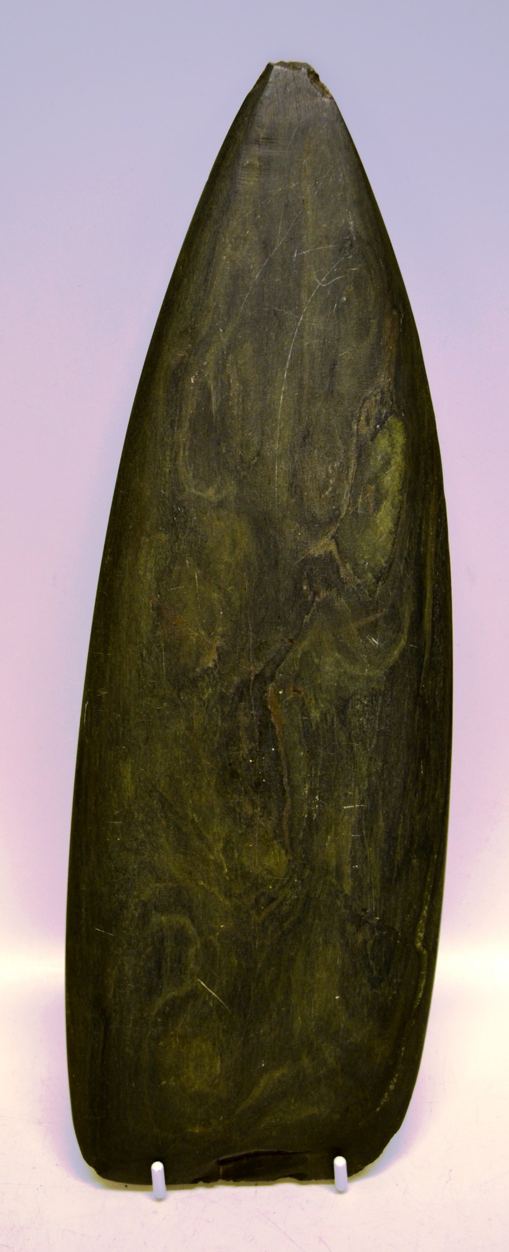 An Oceanic nephrite axe head. (Nineteenth century). 13.3in (34cm).