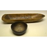 An oak treen bowl (old splits) eighteenth century, 8.25in (21cm) and an antique beech dug out