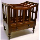An early nineteenth century mahogany music Canterbury, with dipped divisions, the frieze drawer