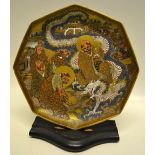 A late nineteenth century Japanese Satsuma ware octagonal saucer dish, decorated immortals and