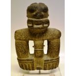 A pre Columbian stone carving, mounted on a modern gallery perspex plinth. 12in (30.5cm).