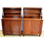 A pair of William IV mahogany chiffoniers, the raised panelled backs, with a top galleried shelf and