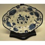 An oval mid eighteenth century bow porcelain blue and white dish, with grapes to the centre and