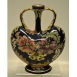 A Royal Bonn 'Old Dutch' pattern heart shape bottle vase decorated flowers and foliage, two scale