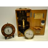 A German brass microscope LEITZ, boxed with accessories. A nineteenth century Aneroid barometer with