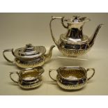 A late Victorian silver four piece tea and coffee service, the rectangular ogee bodies part ribbed
