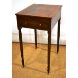 A Regency mahogany drawing table, the well figured veneered rectangular hinged flap top banded in