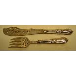 A pair of Victorian silver fish servers, with pierced engraved blades and loaded handles, engraved