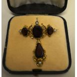 A Victorian garnet gold cross set brooch, 3 garnet with pear shaped garnet drop and 4.5 pearls,