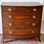 A Regency mahogany veneered bow front chest, of four long graduated drawers, with oval brass plate