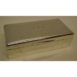 A rectangular silver cedar lined cigarette box, with divisions inside, the lid engraved initials.