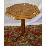 A nineteenth century Continental occasional table, the octagonal oak top an inlaid parquetry star