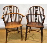 Two mid nineteenth century yew Windsor armchairs, with rail and pierced burr yew splat backs, the
