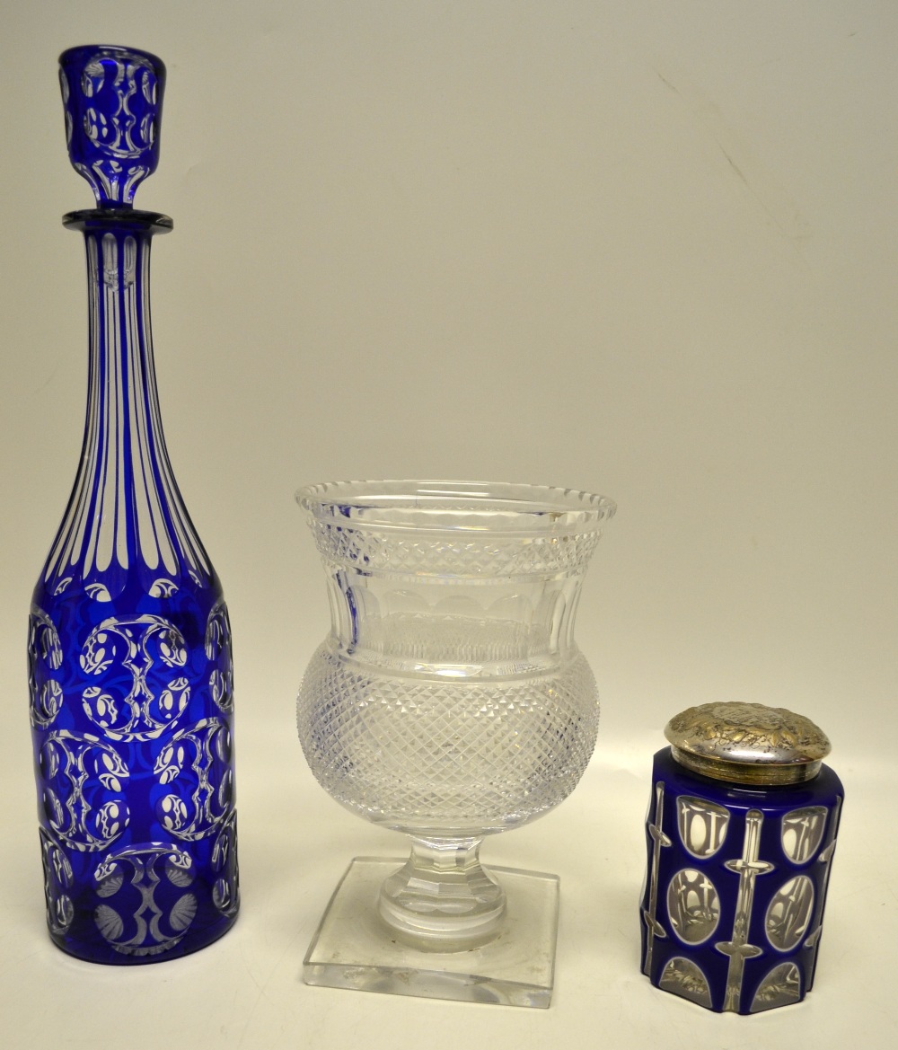A nineteenth century blue overlaid panel cut glass hexagonal jar, with repousse foliage plated