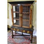 A Dutch East Indies nineteenth century display cabinet on stand, in hardwood and ebony, the