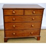An early nineteenth century faded mahogany veneered chest, of two short and three long graduated