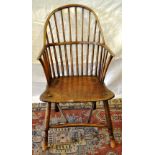 An ash double hooped rail back armchair, the front legs with turned feet and a crinoline
