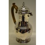 A silver coffee bigin of mid eighteenth century style, the baluster body with a scroll spout with