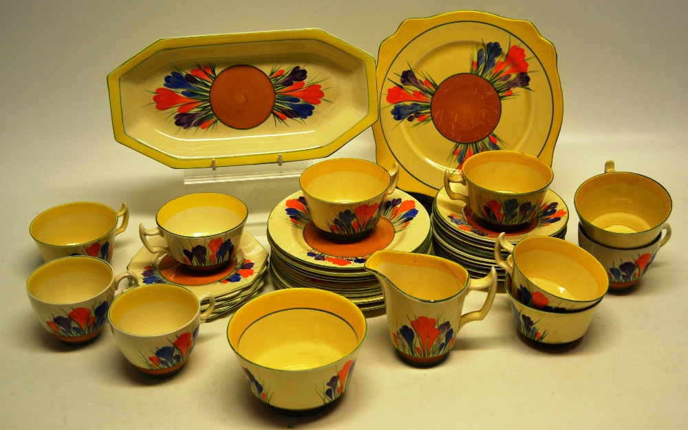 A Clarice Cliff Bizarre Crocus pattern tea service by Wilkinson Ltd and Newport Potteries,