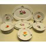 A set of twenty two nineteenth century Meissen porcelain dinner plates, hand painted different