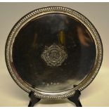 A Queen Anne silver salver, the centre engraved a monogram within a cartouche, a raised gadroon