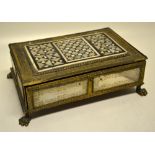 An Eastern chased gilt brass frame writing box, the top with a parquetry ebony, mother of pearl