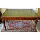 A Victorian mahogany partners writing table, the rectangular top inset recent gilt tooled green