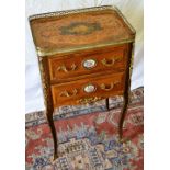 A French chiffonnierre mahogany and rosewood veneered, the top with a marquetry panel of flowers