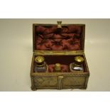 An antique chased brass French casket, in medieval style, the buttoned silk lined interior with