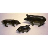 A bronze miniature hound, 2.75in (7cm), a miniature bronze pig, 3.2in (8cm) and a miniature bronze