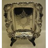 A late Victorian silver rectangular dish, with engraved oval vacant foliage cartouche, pierced