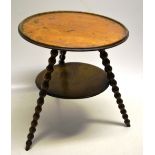 A Victorian walnut gypsy table, the two tiers on 3 ball turned splay legs. 15in (38cm) diameter.