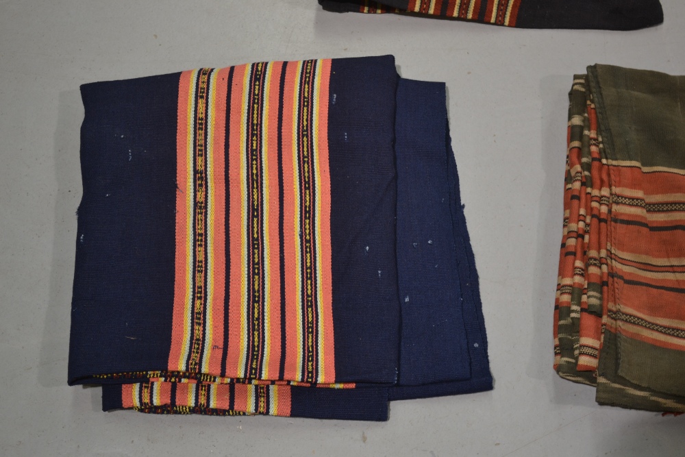 Four Laos women’s skirts, all woven with traditional colourful bands; two black cotton(?) and two - Image 4 of 4