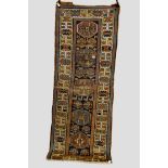 Kurdish long rug, north west Persia, about 1920s, 9ft. 8in. x 3ft. 8in. 2.94m. x 1.12m. Heavy wear